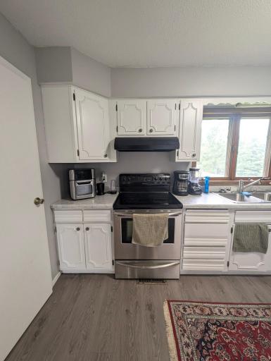 Large, functional kitchen with ample counter space.
