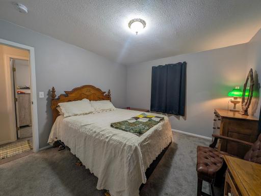 Comfortable main-floor bedroom with peaceful views. Wake up to natural light and the gentle sounds of nature just outside your window.