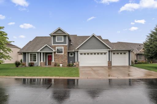 Breathtaking 1 and 1/2 story home with main floor living in The Lakes of Blaine Neighborhood in Blaine, MN. 3 car garage that is sheet rocked, insulated, thermostat in garage, attic storage and a floor drain.