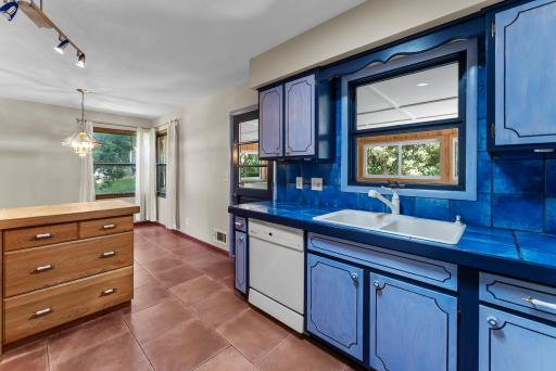 Adding to the home's bright and welcoming feel, Solatube skylights in the kitchen, bathroom, and hallway bathe the spaces in soft, natural light throughout the day.