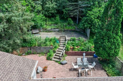 Enjoy a lovely outdoor swing, along with a patio table and chairs.