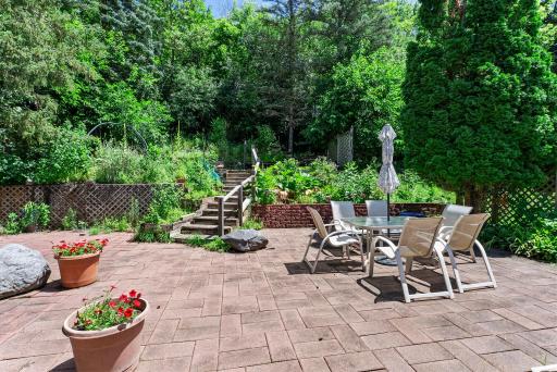 The expansive, two-tiered rear patio is made for entertaining, featuring built-in gas plumbing for your grill (no more propane tanks!).