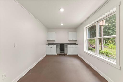 Lower level features a flexible room perfect for an office or hobby space.