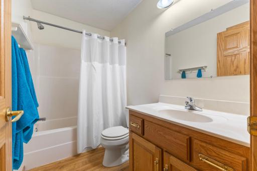 Freshly painted full bathroom on the main floor, conveniently located between two bedrooms.