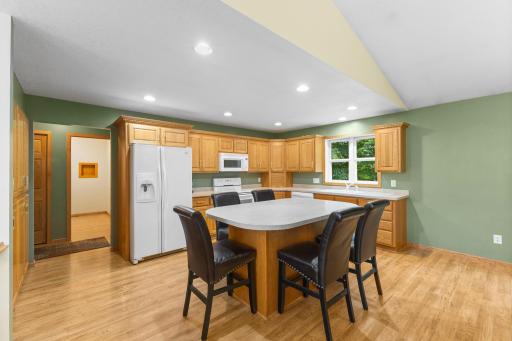 Kitchen features a center island with seatingâperfect for casual dining.