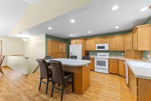 Kitchen and main floor feature durable vinyl flooring that beautifully complements the natural woodwork.