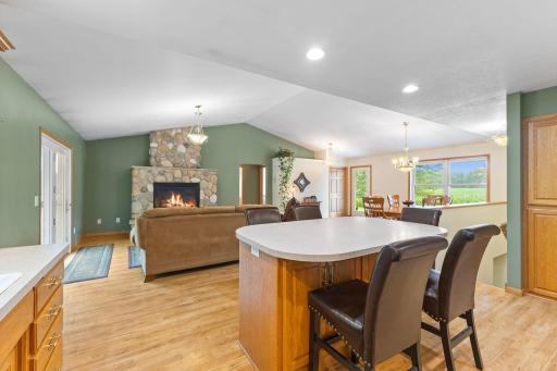 Open view of the kitchen island overlooking the living and dining areasâideal for connected living.