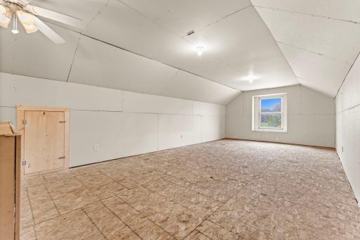 Bonus man cave or amusement room above the garageâsheetrocked and ready for your finishing touch.
