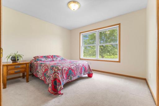 Freshly painted front-facing bedroom with newly cleaned carpet.