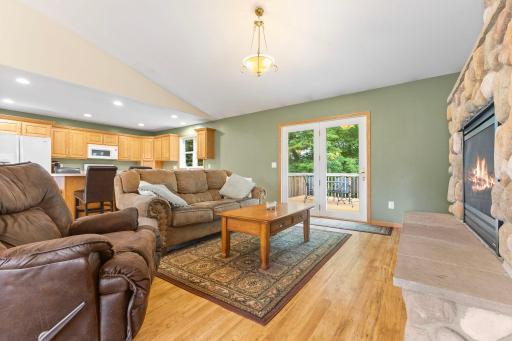 Bright living room with walk-out access to the deckâperfect for indoor-outdoor living.