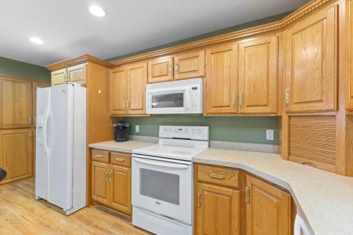 Kitchen offers ample counter and cabinet space for all your needs.
