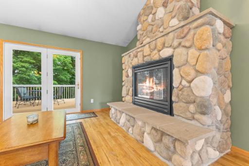 Beautiful stone fireplace adds warmth and charm.