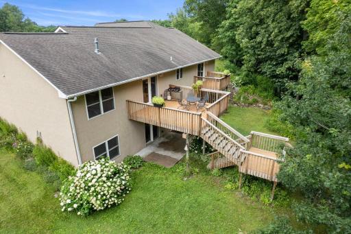 Scenic backyard view showcasing multiple decks and a spacious patio for outdoor living.