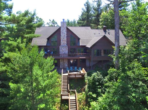 Impressive executive home with tiered decking with easy steps to the waterfront.