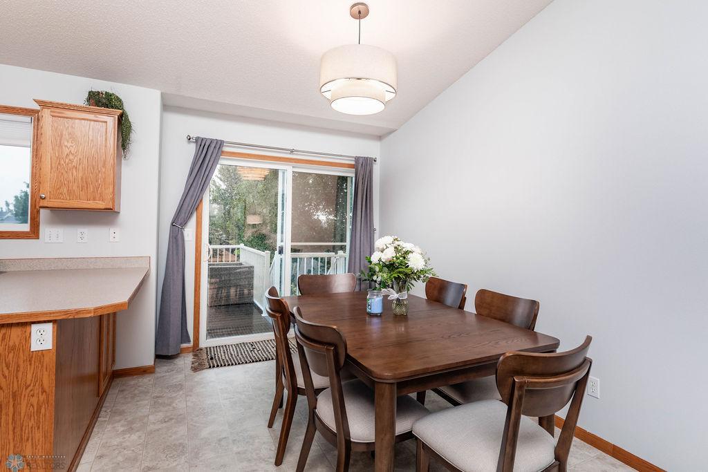Dining area adjacent to kitchen & looks out to large deck & backyard