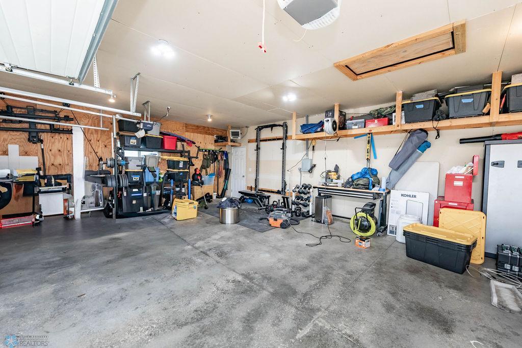 3-car garage is insulated and offers heater, overhead storage, attic access