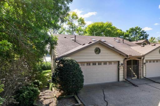 Welcome to this gracious townhome set in a quiet neighborhood offering spectacular views of Gleason Lake!