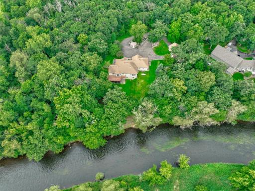 Set on 3.3 private acres along the scenic Apple River, this beautiful custom-built La Casse home offers 4 bedrooms, 3 bathrooms, and over 3,500 sq ft of thoughtfully designed living space with an unmatched connection to the outdoors.