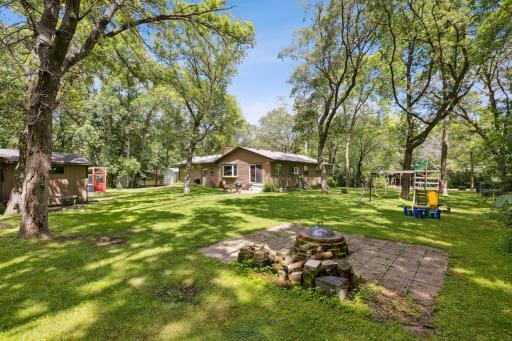Nice paver patio holds a large firepit. With all the trees, you'll have an endless supply of wood for those summer bonfires.