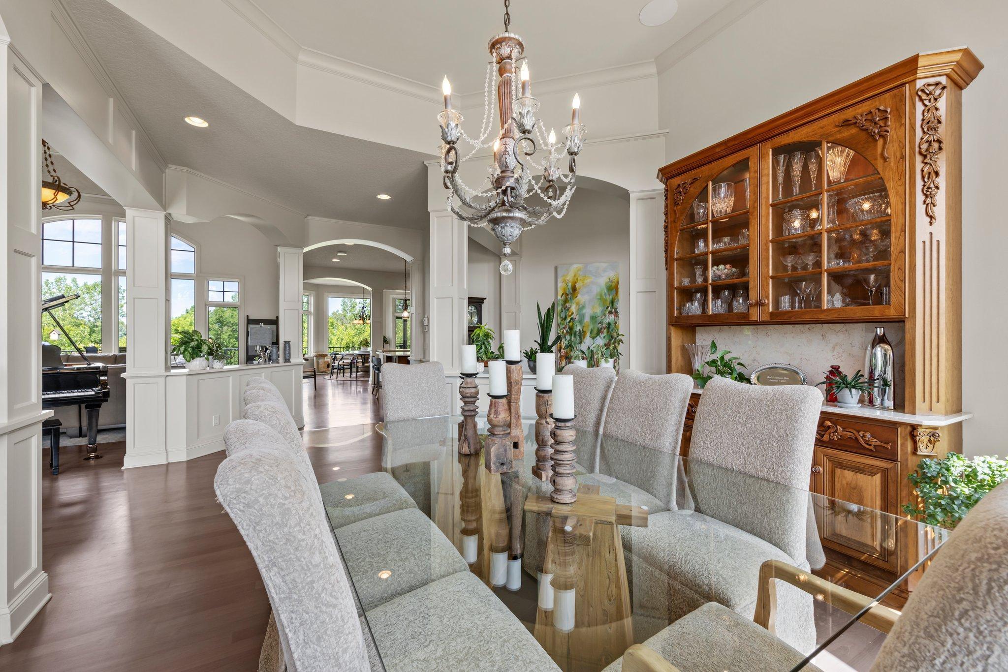 Open sightlines from the formal dining room to the great room, kitchen and beyond- ideal layout for gatherings and everyday flow. Arched openings and detailed millwork tie each space together beautifully.