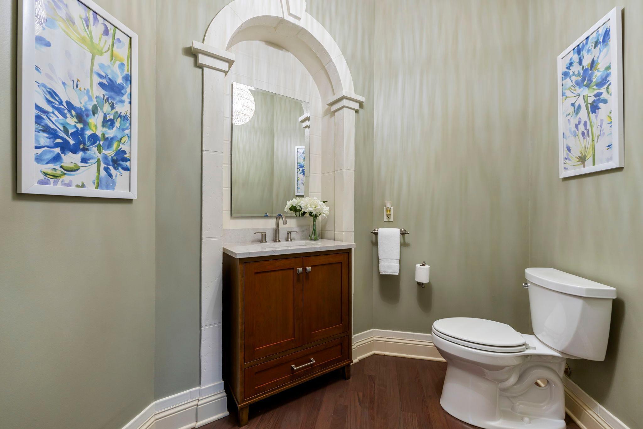 Powder room just off the study on the main level