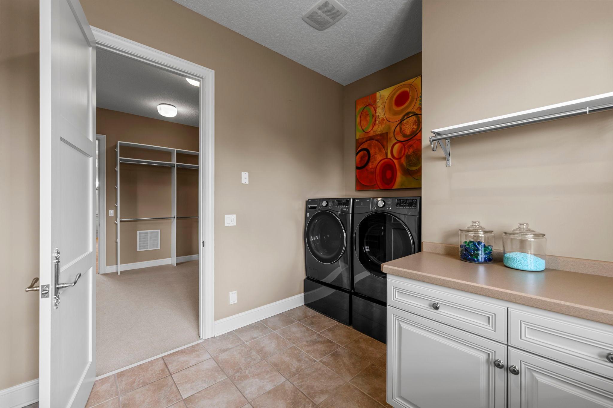 Main floor laundry room in the Primary bedroom suite. There is laundry in the lower level as well!