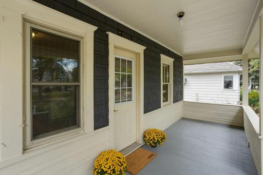 Welcoming open porch offers room to sit and enjoy the neighborhood