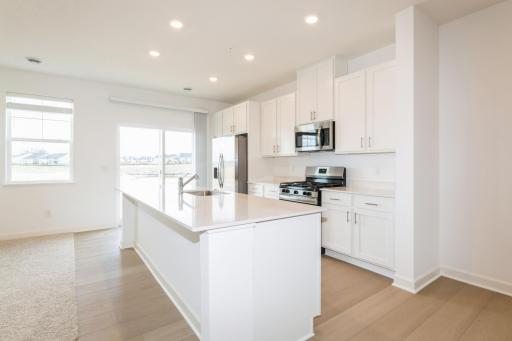 (This is a photo of a similar home!) Welcome to the beautiful St. Clair! Enjoy plenty of storage space in all the cabinets and lots of seating options at the large center island!