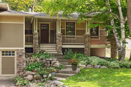 The grand front porch greets you at 220 Glenbrook Rd. N. Add a couple rocking chairs and this front porch is perfect for sipping cool iced tea and reading a good book.
