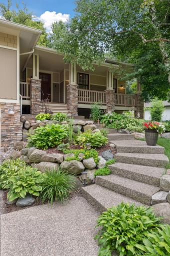 This front porch practically begs for morning coffee and evening wine. Bonus points for the dreamy landscaping!