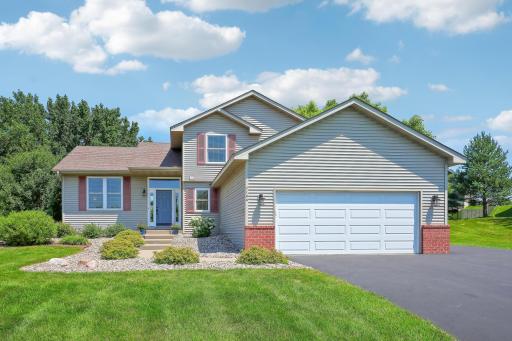 Gorgeous modified two story with a double car garage and a space included in the driveway for a third car!