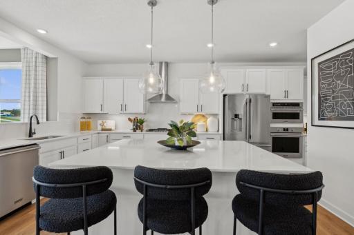 (Photo of model home, finishes will vary) With ample cabinetry storage, everything is kept both within reach and out of sight at the same time