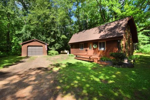 Tranquility and charm, nestled among 4 wooded acres