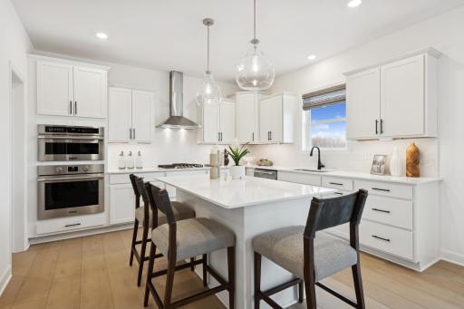 (Photo of decorated model, actual homes finishes will vary) Enjoy island seating for quick snacks or informal dining for a crowd.