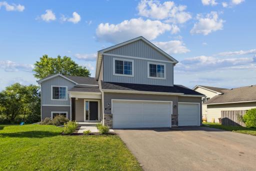 Charming curb appeal with spacious 3-stall garage entry