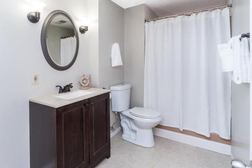 Three-Quarter Bath with Updated Vanity and Tile Floor