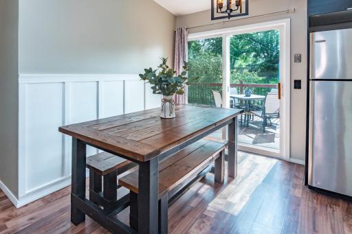 Dining Room with Updated Paneled Wall and Light Fixture