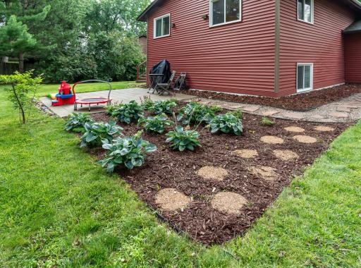 The yard features easy-care perennials and a nice backyard entertaining space.