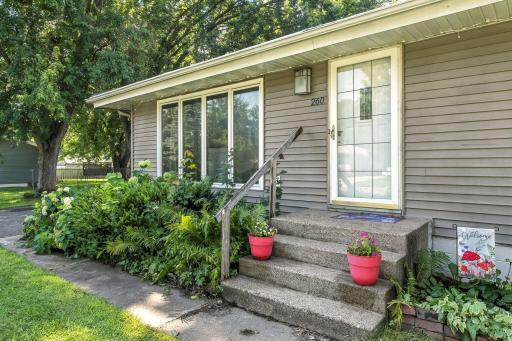 The home’s neutral maintenance-free vinyl siding and gutters offer long-lasting durability and a clean, modern look with minimal upkeep required.