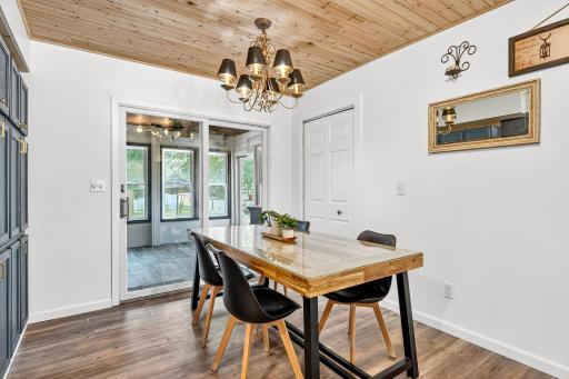 Walk- out the sliding glass door access to the sunroom, perfect for entertaining.