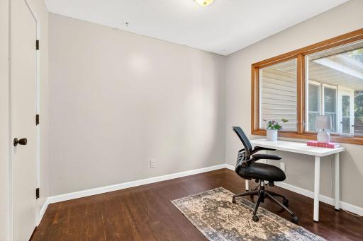 The 3rd bedroom connects to the primary bedroom, with a sliding barn door access.