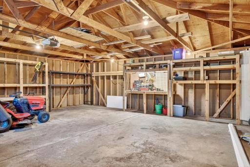 The oversized 2 car garage has built-in shelving.
