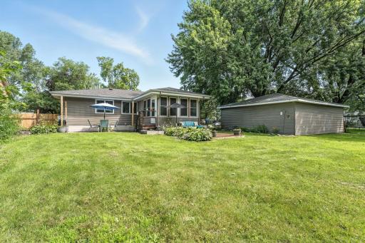 The expansive 0.4-acre lot is completely fenced, offering privacy and ample space for outdoor enjoyment.