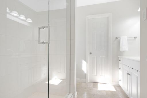 Main floor primary 3/4 bathroom, complete with large walk in closet.
