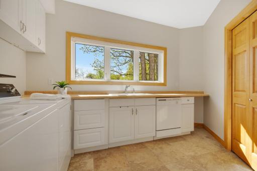 And an oversized main floor laundry room which could be easily converted into a large butlers panty. This space is already equipped with sink and dishwasher!
