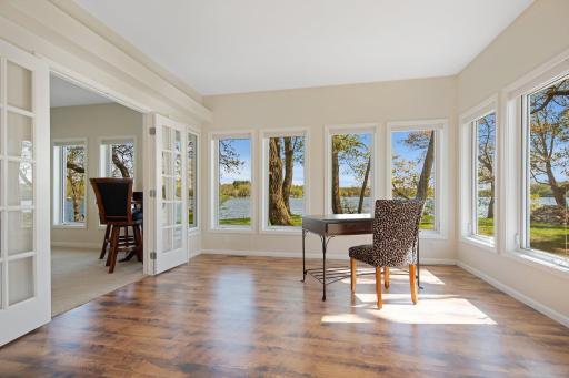 Flow on into this sun drenched room off the game room for additional entertaining space. Or, could be converted into another main floor bedroom, office, etc.