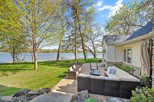 Welcome HOME to your very own, private peninsula on Lake Julia. Surrounded by custom landscaping, home also features an oversized concrete patio allowing for even more entertaining space, and areas to enjoy the exceptional privacy and views.