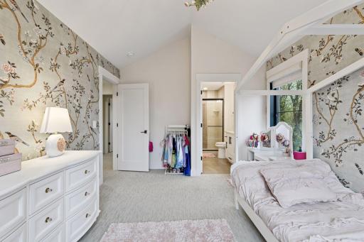 En-suite bedroom and bathroom with custom closet systems