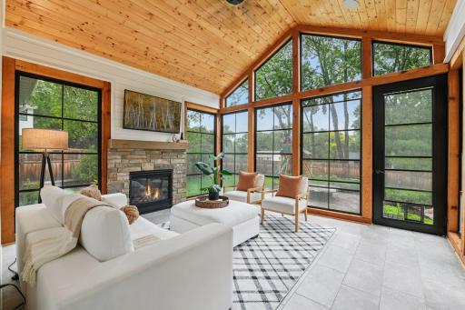 Soaring vaulted ceiling sunroom with Ez screen overlooking the backyard