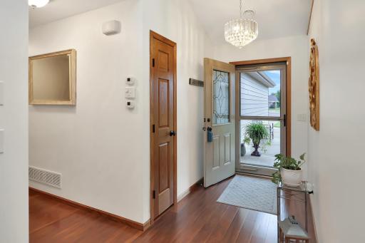 Vaulted front entry with storm door and coat closet..jpg